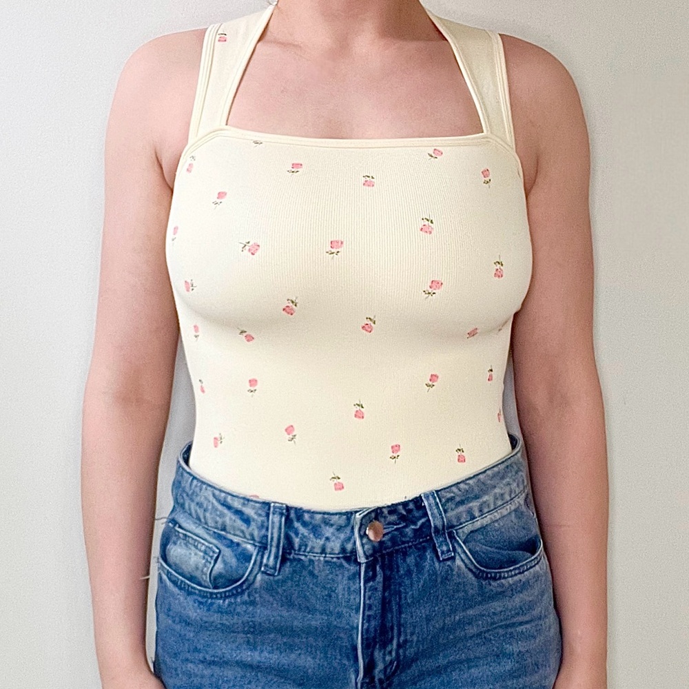 Snatching nude and rose bodysuit